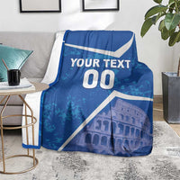 Blue throw blanket with white diagonal accents, “YOUR TEXT 00,” and Colosseum artwork