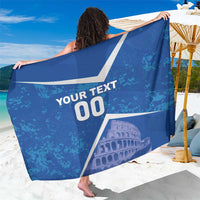 Blue sarong folded for display with white 'YOUR TEXT 00' and Colosseum graphic