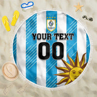Round beach towel blanket with Uruguay crest, blue-and-white stripes, sun graphic, fringe