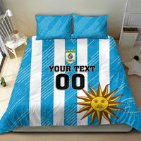 Blue bedding set with white vertical stripes, sun graphic, crest, and "YOUR TEXT 00".