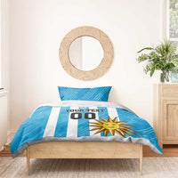 Blue football bedding set with white stripes, sun graphic, crest and "YOUR TEXT 00".