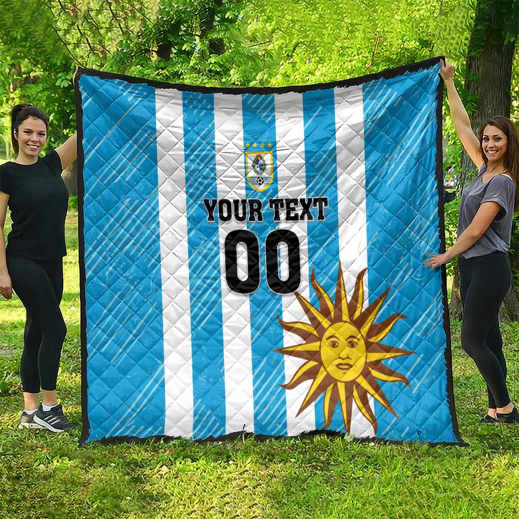 Blue football quilt with white stripes, sun design, crest, and large custom number 00