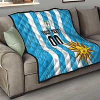 Blue football quilt with white diagonal stripes, sun graphic, crest, and custom text