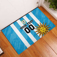 Blue striped rubber doormat with custom 'YOUR TEXT 00' panel, Uruguay crest and sun.