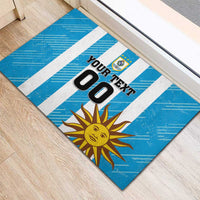 Blue football-themed rubber doormat with white stripes, crest, sun graphic, and 'YOUR TEXT'.