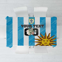 Blue custom football tablecloth with Uruguay crest and sunburst graphic, flat view