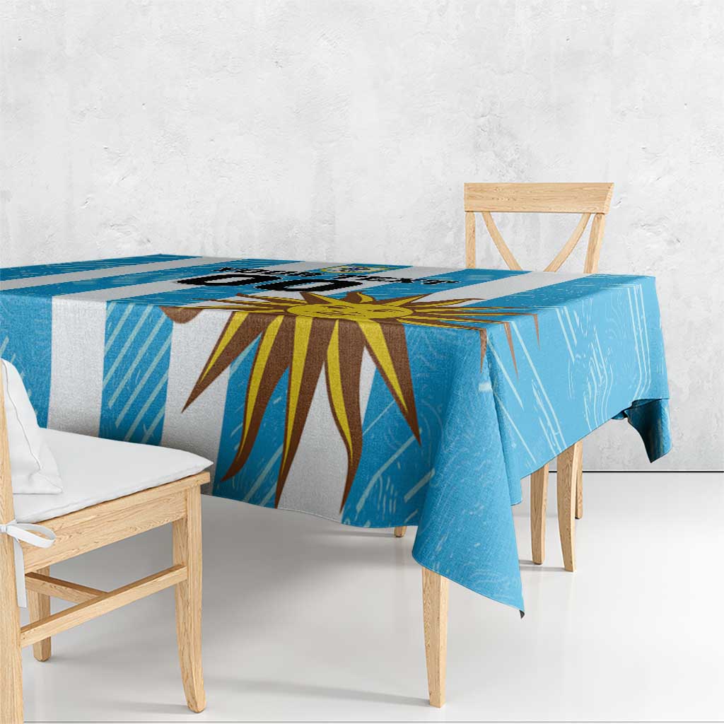 Blue football tablecloth draped over a bench with sunburst graphic centerpiece