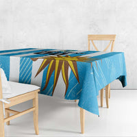 Blue football tablecloth draped over a bench with sunburst graphic centerpiece