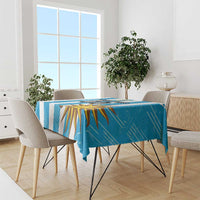 Blue Uruguay-inspired football tablecloth covering a dining table with sunburst artwork