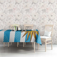 Blue Uruguay-themed football tablecloth with sunburst design on a dining table