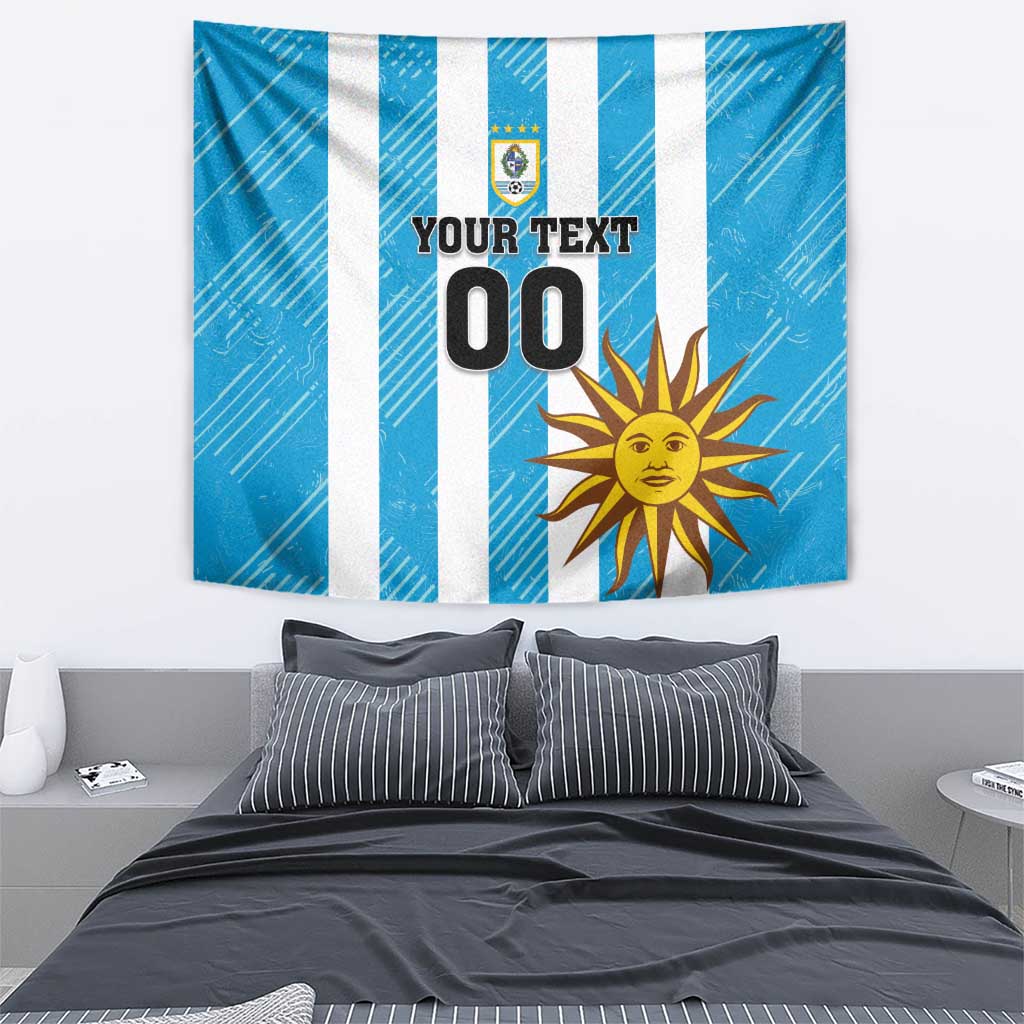 Blue wall tapestry with white vertical stripes, crest, sun icon, and “YOUR TEXT 00”