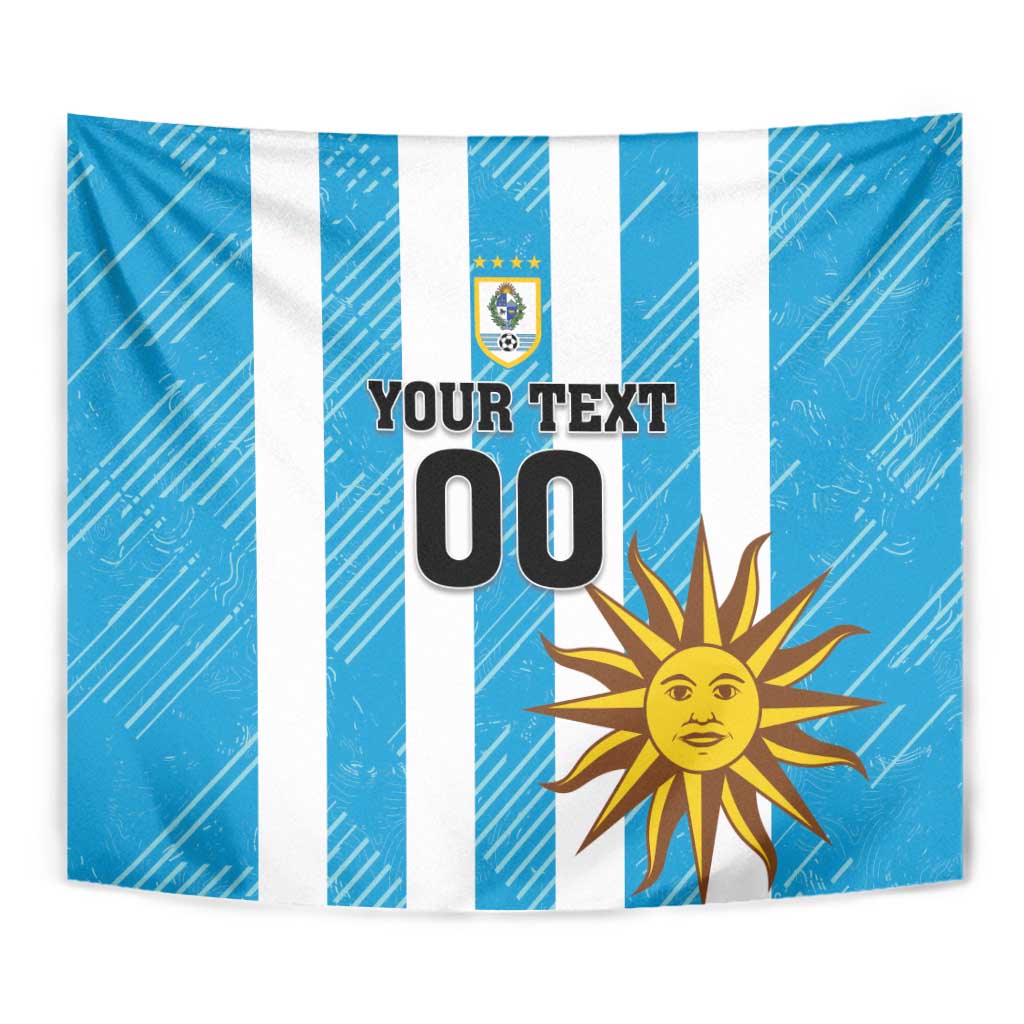 Blue wall tapestry featuring white stripes, crest emblem, sun icon, and “YOUR TEXT 00”