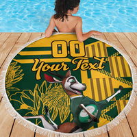 Fringed round beach blanket laid flat, green/yellow springbok graphic with “Your Text”
