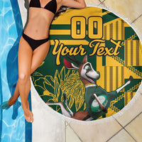 Close-up fringed round beach blanket, green/yellow springbok graphic with “Your Text”