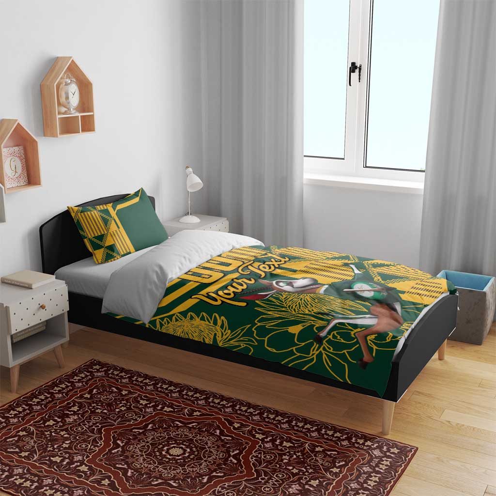 Green and yellow bedding set on bed with personalized text and bird-and-floral print, two pillows