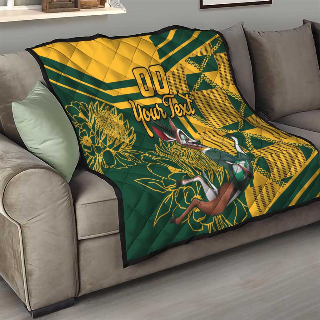 Custom South Africa rugby quilt on gray sofa, yellow-and-green geometric design and “Your Text”