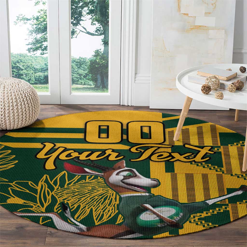 Round rugby carpet in yellow and green with “Your Text” lettering and animal mascot