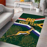 Green custom rug featuring springbok silhouette, flag band stripes, and leaf pattern