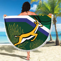 Round South Africa rugby beach blanket with Springbok mascot and fringe border, held outdoors