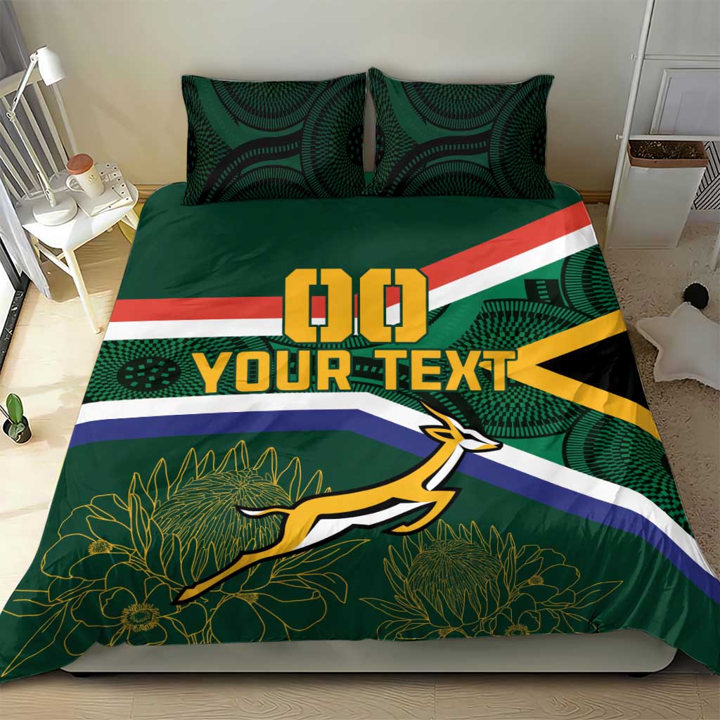 Green rugby duvet and pillow shams with flag stripes, springbok mascot, and plant pattern