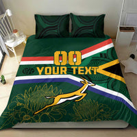Green rugby duvet and pillow shams with flag stripes, springbok mascot, and plant pattern