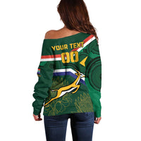 Women’s off-shoulder green sweater with back text “YOUR TEXT 00” and mascot graphic
