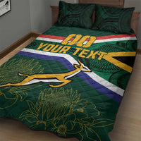 Green rugby quilt with stripe bands, antelope mascot, and 'YOUR TEXT' across the bed.