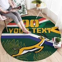 Round rugby theme rug with green, blue, yellow stripes, mascot graphic, custom text