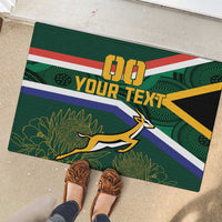 Green rubber doormat with South Africa flag design, 'DO YOUR TEXT' and antelope graphic.