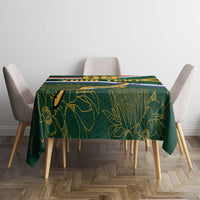 Rugby tablecloth on square table with green leaf artwork and multicolor stripe bands