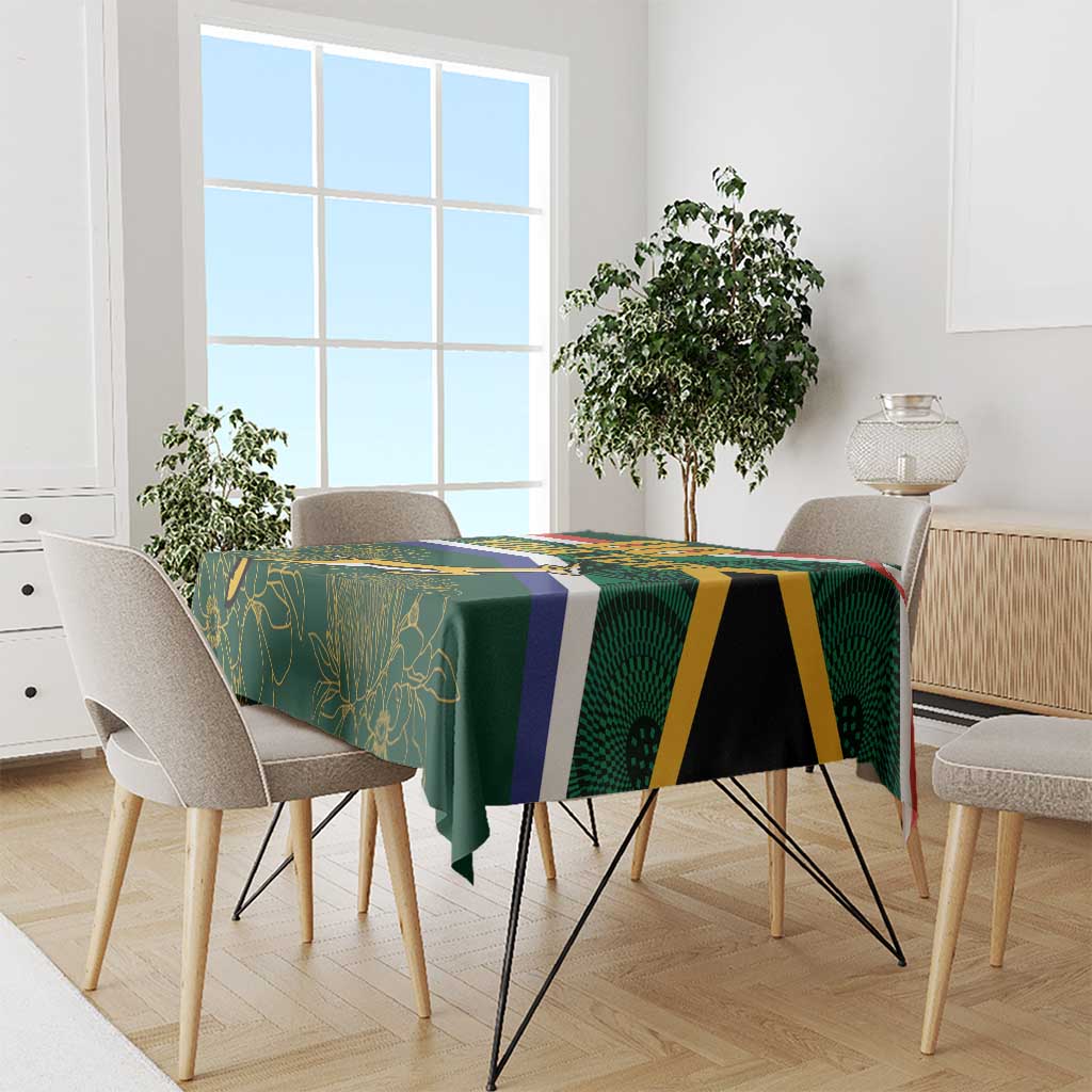 Rugby tablecloth on dining table with green leaf design and navy, gold, and black stripes