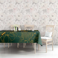 Rugby tablecloth with green leaf-pattern border and multicolor stripes on dining table