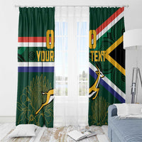 Green window curtains with South Africa flag stripes, springbok graphic, and light background.