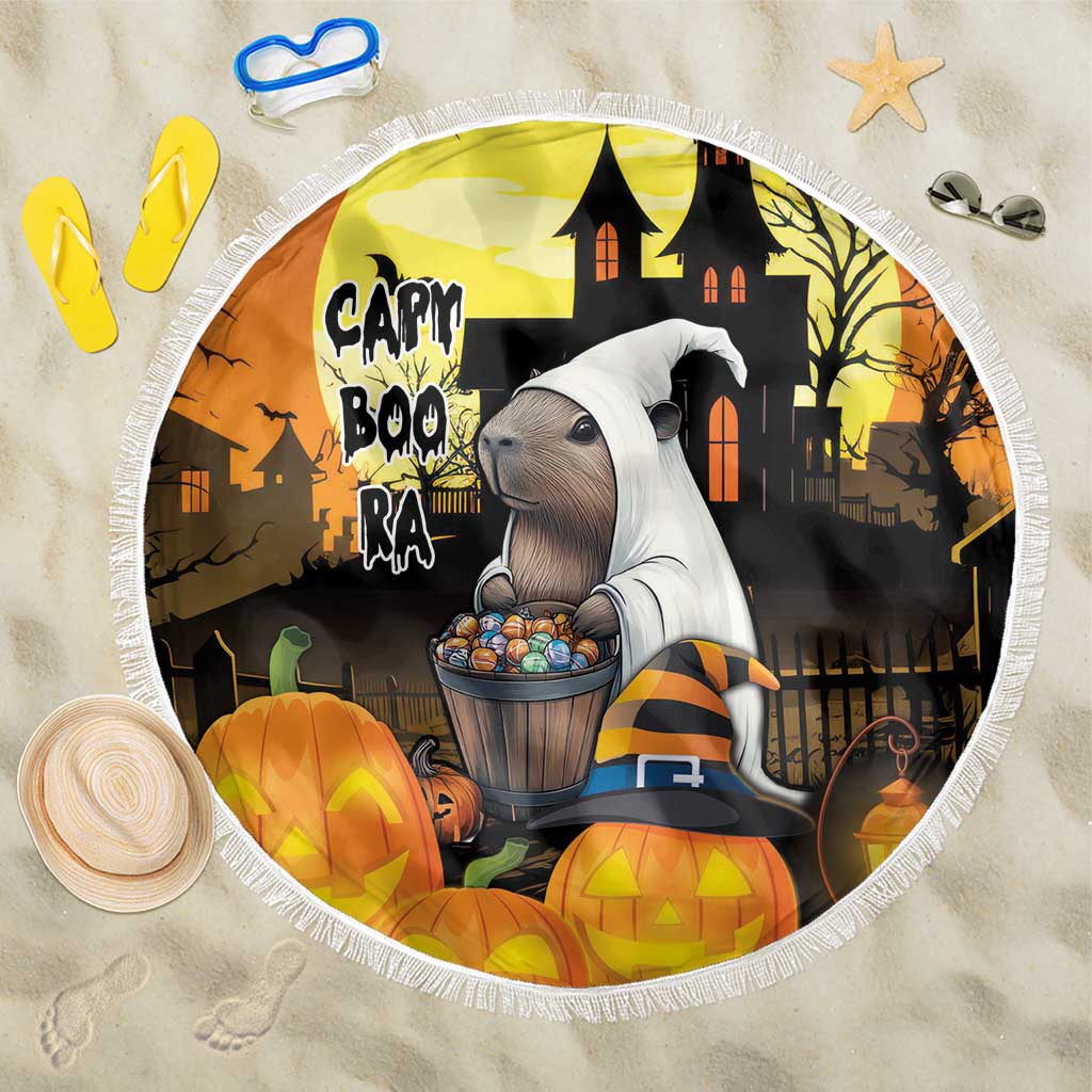 Round beach blanket with haunted house, capybara holding candy, and jack-o'-lanterns, fringe