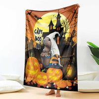Orange Halloween throw blanket featuring haunted house, jack-o-lanterns, and lanterns