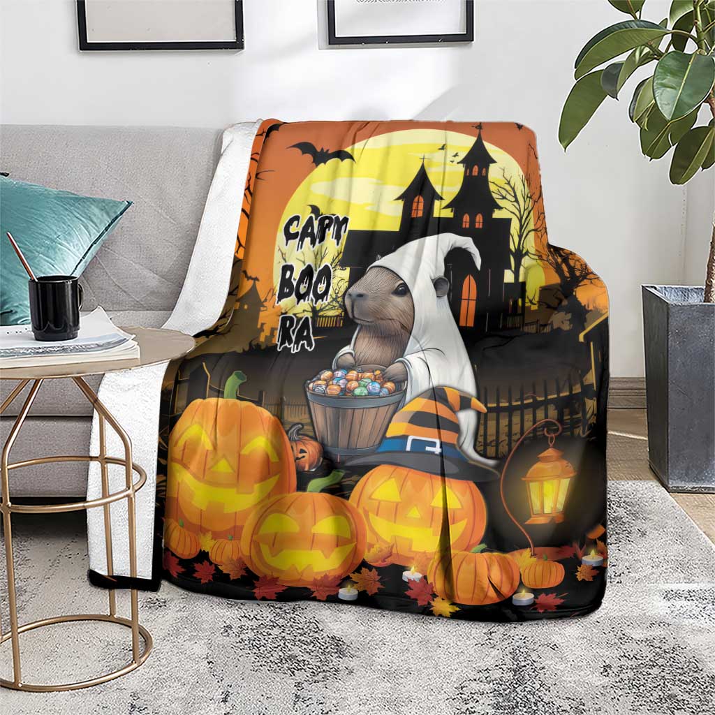 Orange Halloween blanket with haunted house backdrop and jack-o-lanterns, lantern detail