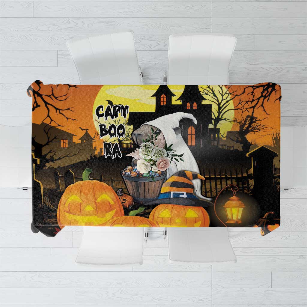 Orange and black Halloween tablecloth with haunted house, jack-o-lanterns, and bats design