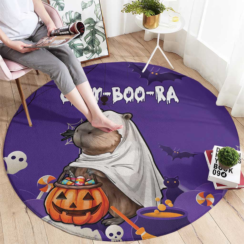 Purple round Halloween rug with capybara, jack-o'-lantern, bats, candy and ghosts
