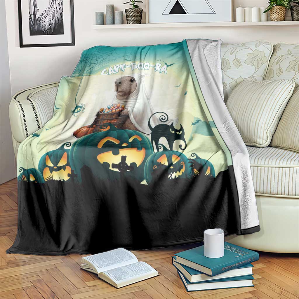 Green Halloween blanket with cartoon puppy holding pumpkins, jack-o'-lanterns and bats