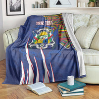 Personalized blue blanket with coat of arms, kente border, and custom text in the center