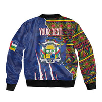Blue bomber jacket back with crest graphic and multicolor kente-pattern panels