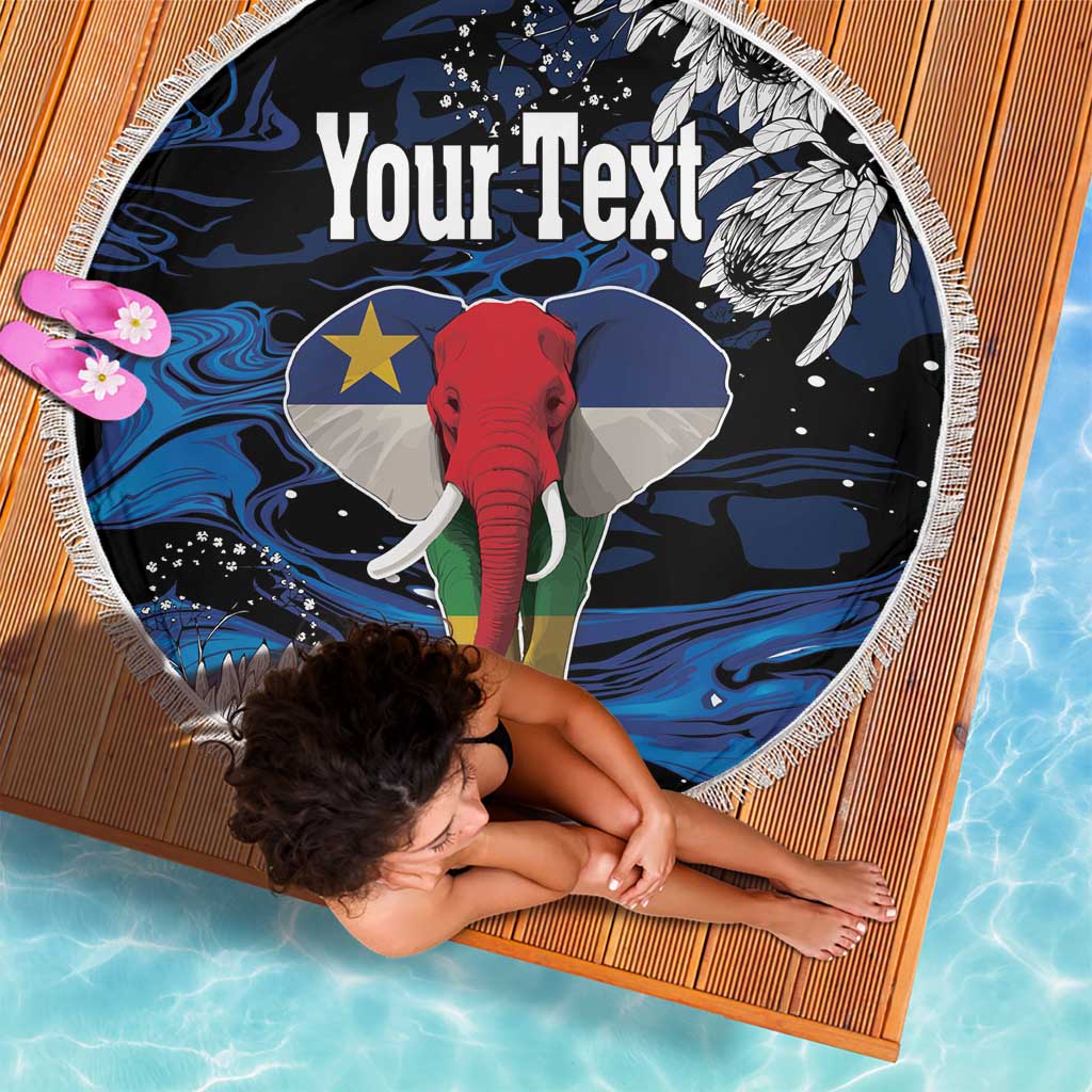 Round beach blanket with fringe, elephant and star over blue wave pattern, 'Your Text' centered