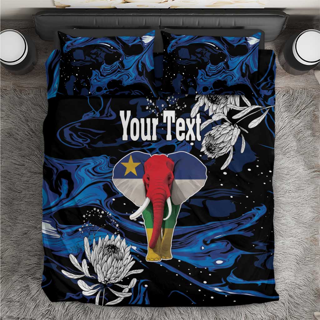 King bedding set with blue-black elephant print, protea flowers, and matching pillowcases