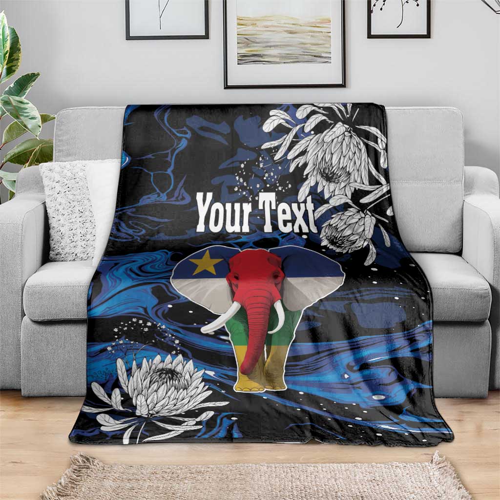 Personalized blanket draped on sofa, blue-black elephant and white floral pattern, Your Text