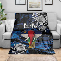 Personalized blanket draped on sofa, blue-black elephant and white floral pattern, Your Text