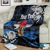 Personalized king blanket on couch, black and blue waves with elephant, Your Text, white blooms