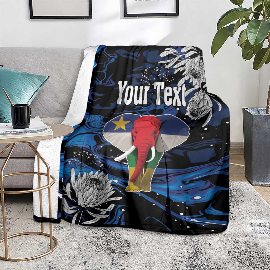 Personalized king blanket on floor, black with blue swirls and elephant art, Your Text