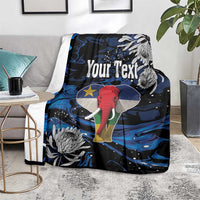 Personalized king blanket on floor, black with blue swirls and elephant art, Your Text