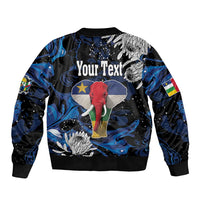 Black bomber jacket with elephant graphic, blue abstract pattern, ribbed hem and cuffs