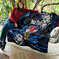 Black and blue quilt blanket held on couch, elephant art, floral accents, and 'Your Text'